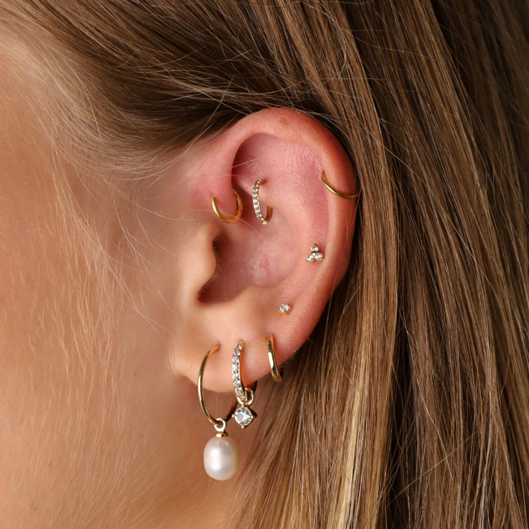 oreille avec des piercings